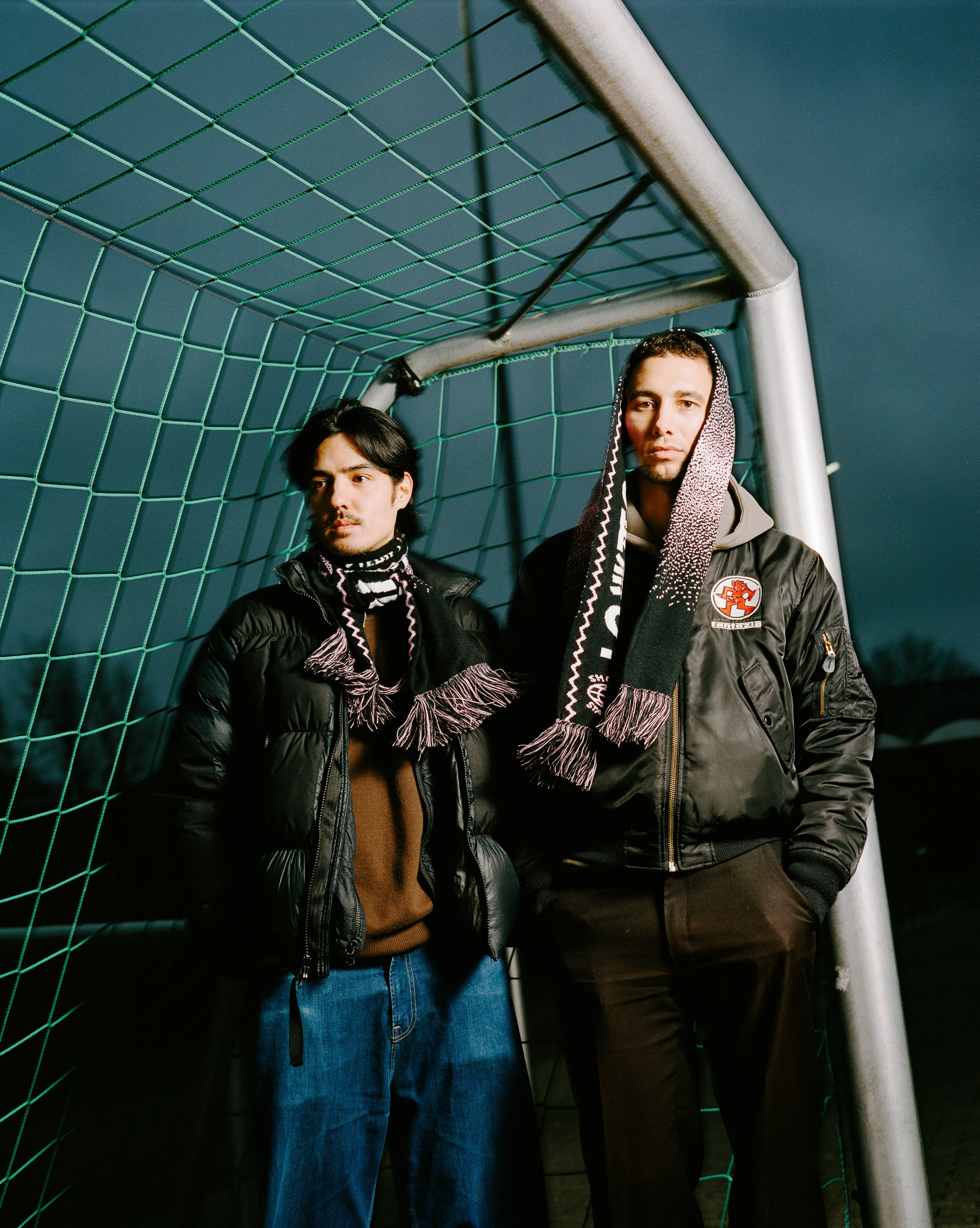 Wearing the safelight football scarf in a football field closeup