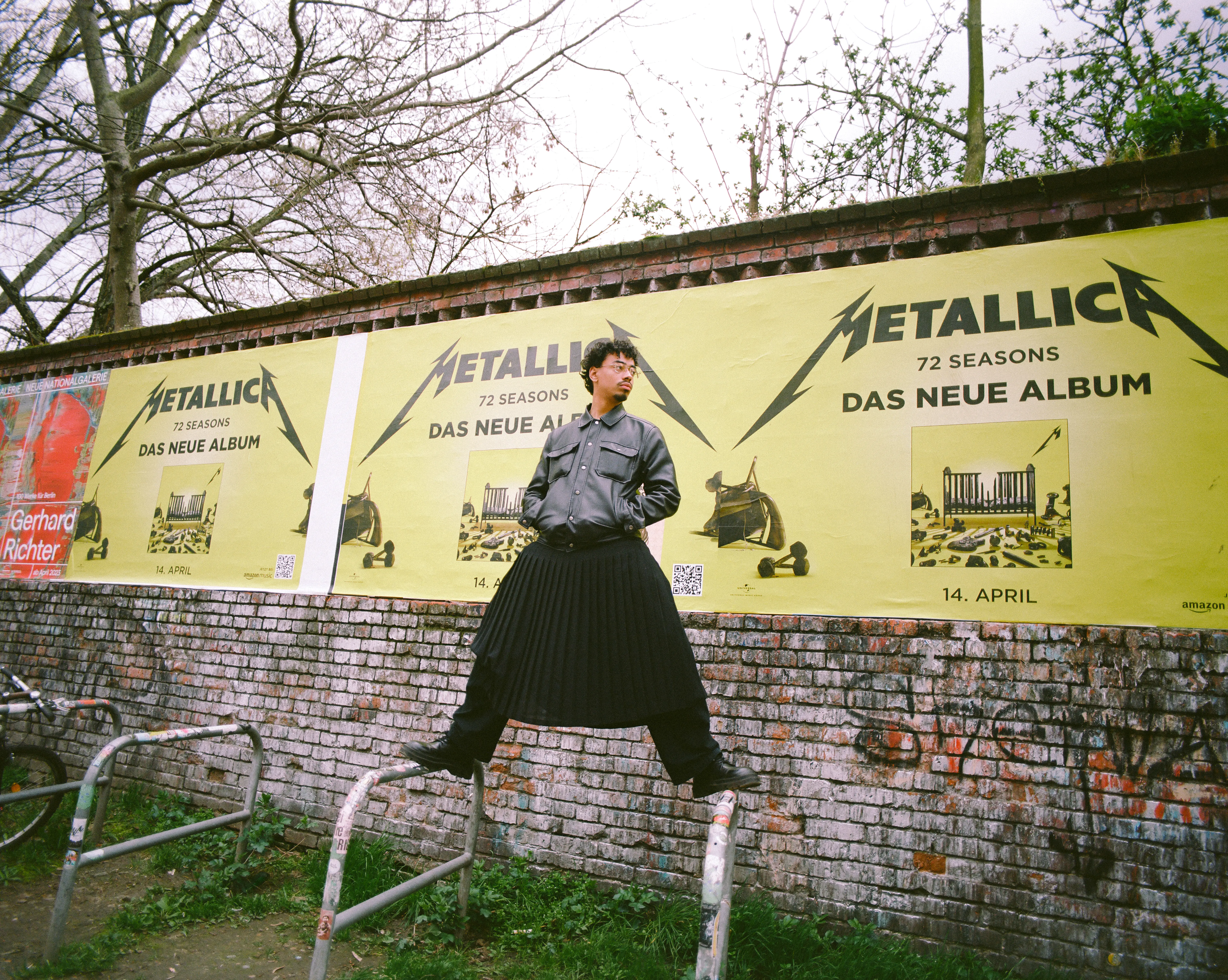 Wide angle shot of Noah standing on poles